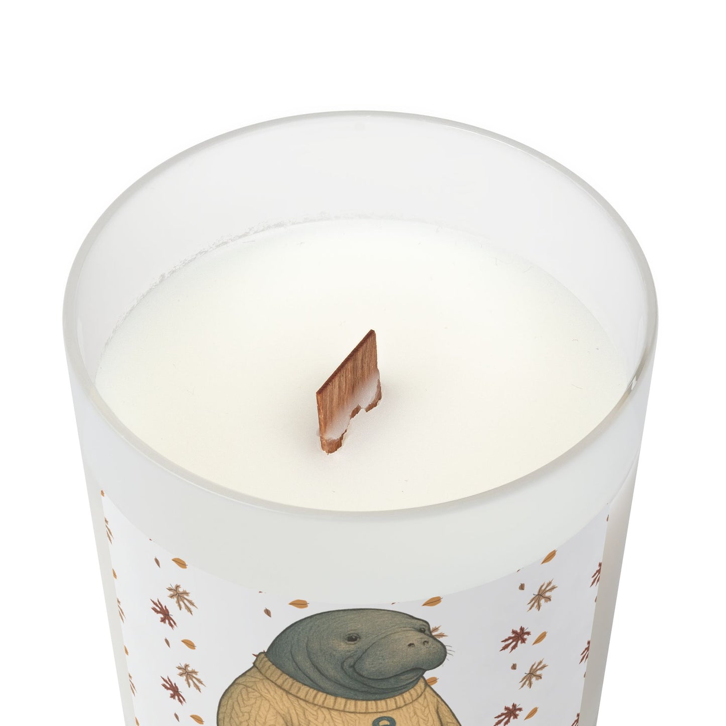 Candle with a design of a beaver wearing a sweater on a white background