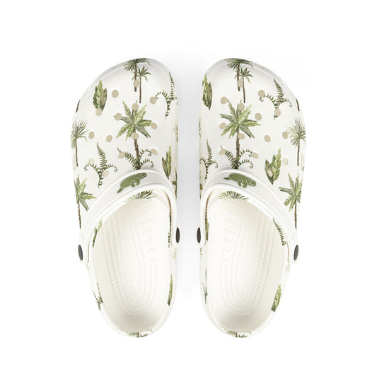 White clogs with tropical plant pattern on a white background