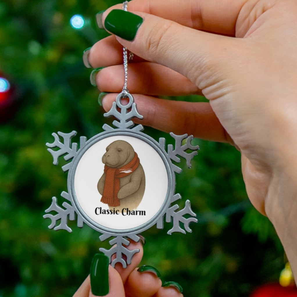 Person holding a snowflake-shaped ornament with a dog design against a Christmas tree background