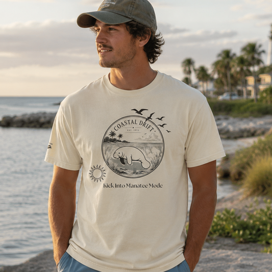 Man wearing a t-shirt with a bear graphic and text by the beach
