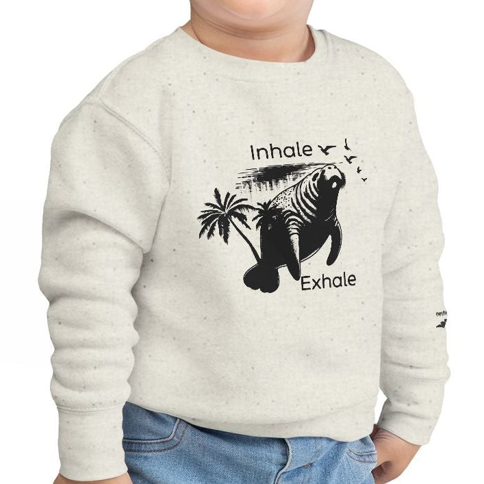 Child wearing a white sweatshirt with a graphic design on a white background