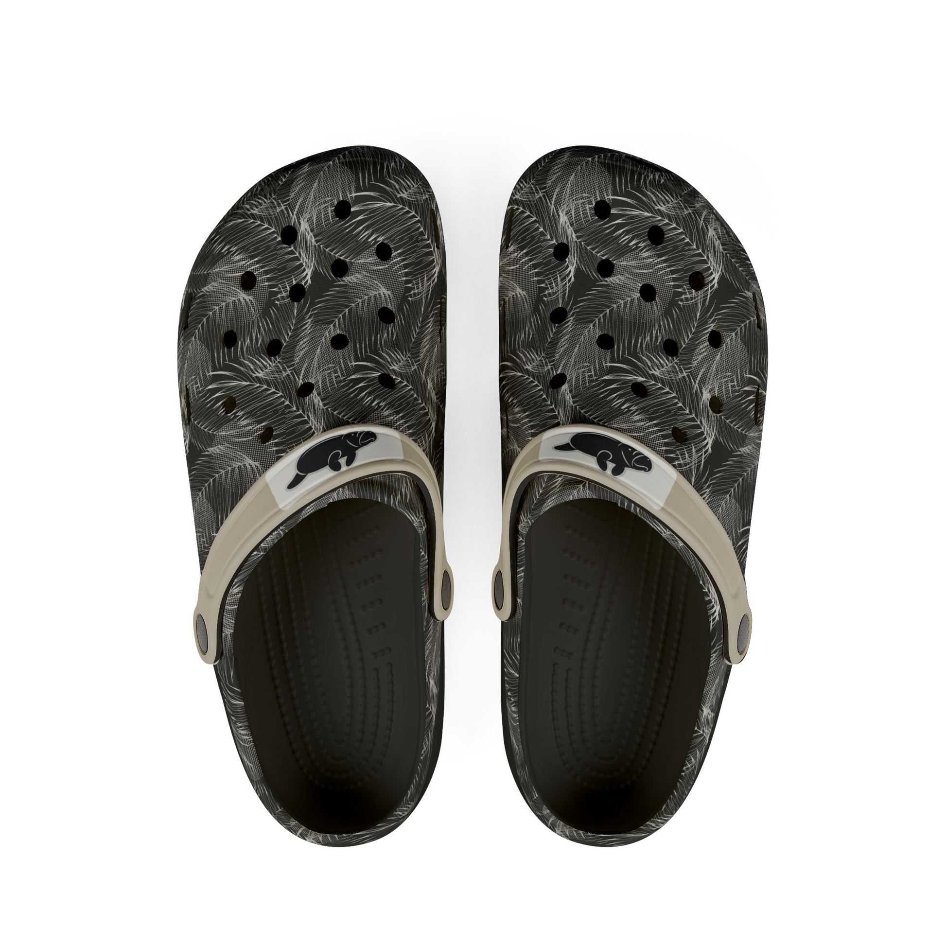 A pair of black and gray palm-leaf patterned clogs with beige straps and a black beaver logo, shown from a top-down view on a white background.