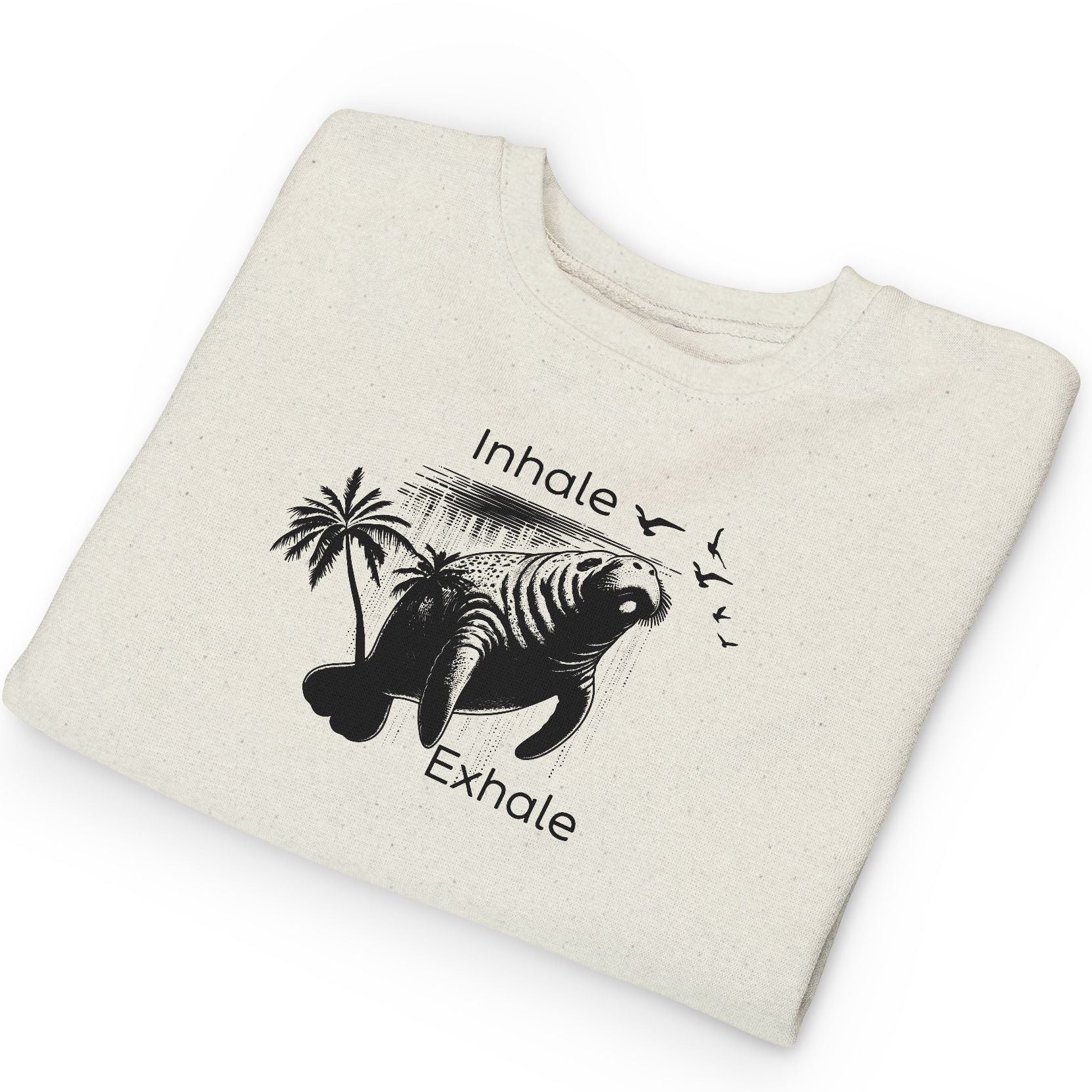 Folded beige sweatshirt with a black graphic and text on a white background