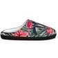 A single slip-on mule slide shoe with a tropical print featuring pink hibiscus flowers and green palm leaves on a dark navy background, with a solid black sole.