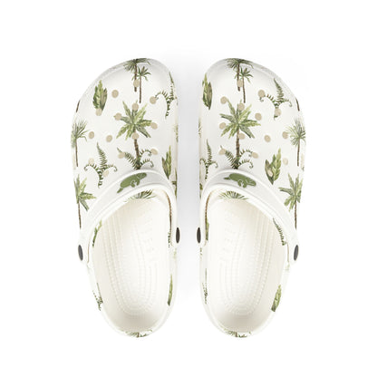 White clogs with tropical plant pattern on a white background