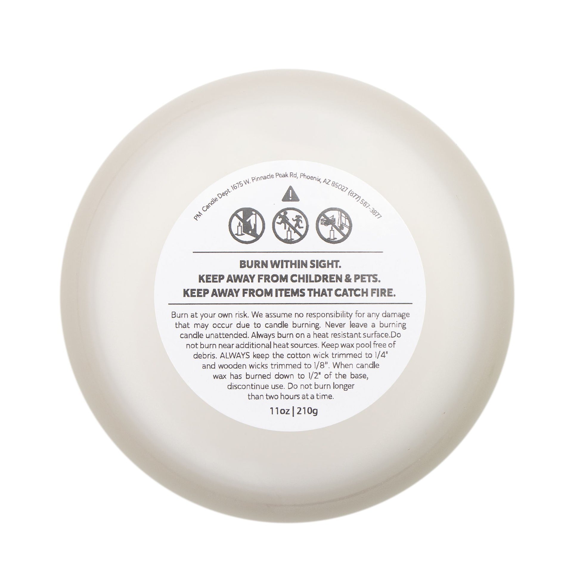 White candle with a label on a white background