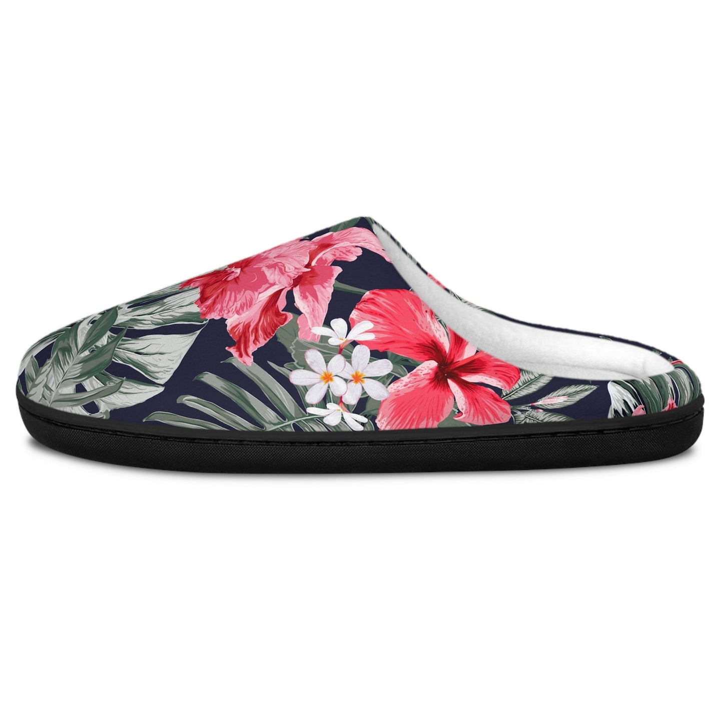 A single slip-on mule slipper with a tropical floral print featuring pink hibiscus flowers, white plumeria blossoms, and green leaves on a dark navy background, shown against a plain white background.