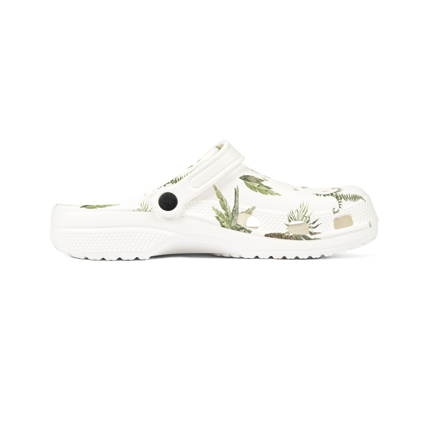 White clog shoe with green leaf pattern on a white background