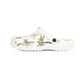 White clog shoe with palm tree design on a white background