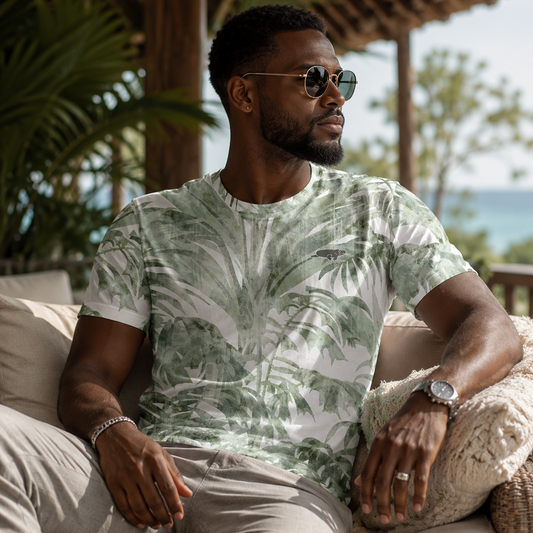 Man wearing a tropical print shirt sitting on a couch outdoors.
