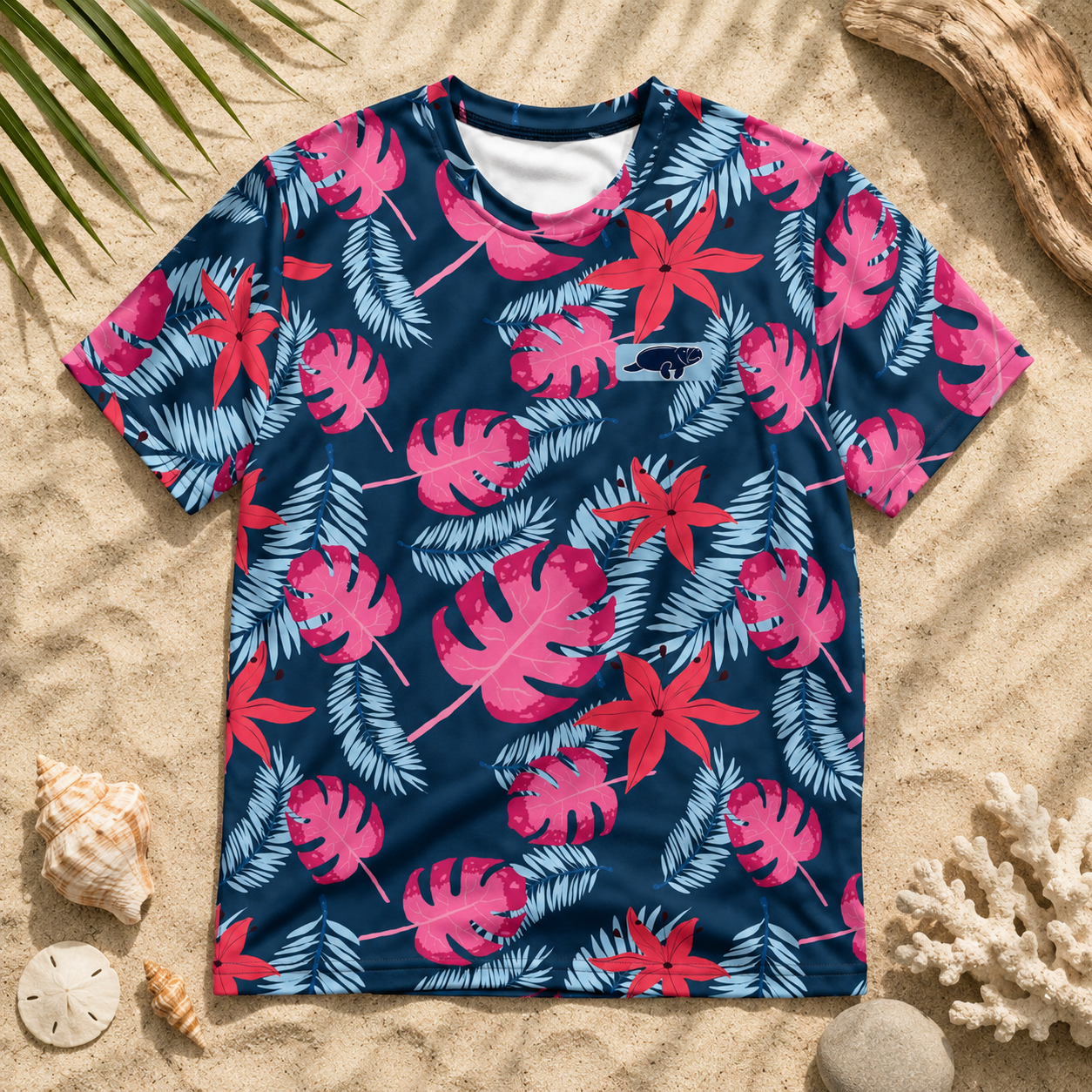 T-shirt with pink and blue leaf pattern on a sandy background