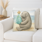 Decorative pillow with a manatee holding a Christmas tree on a white couch.