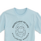 A close-up view of the front print design of the Blue Mist Protect Manatee T-Shirt, with a striking illustration of a manatee and the phrase "Protect What You Love.