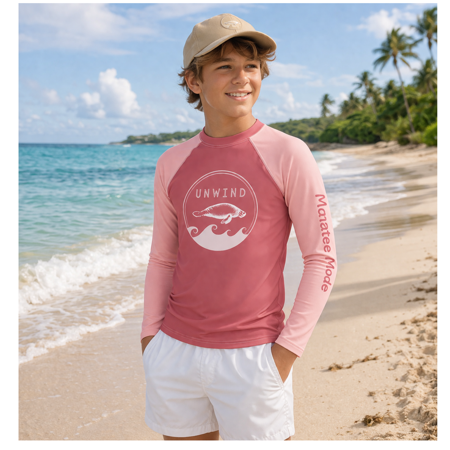 Child wearing a pink long-sleeve shirt with a logo on a beach
