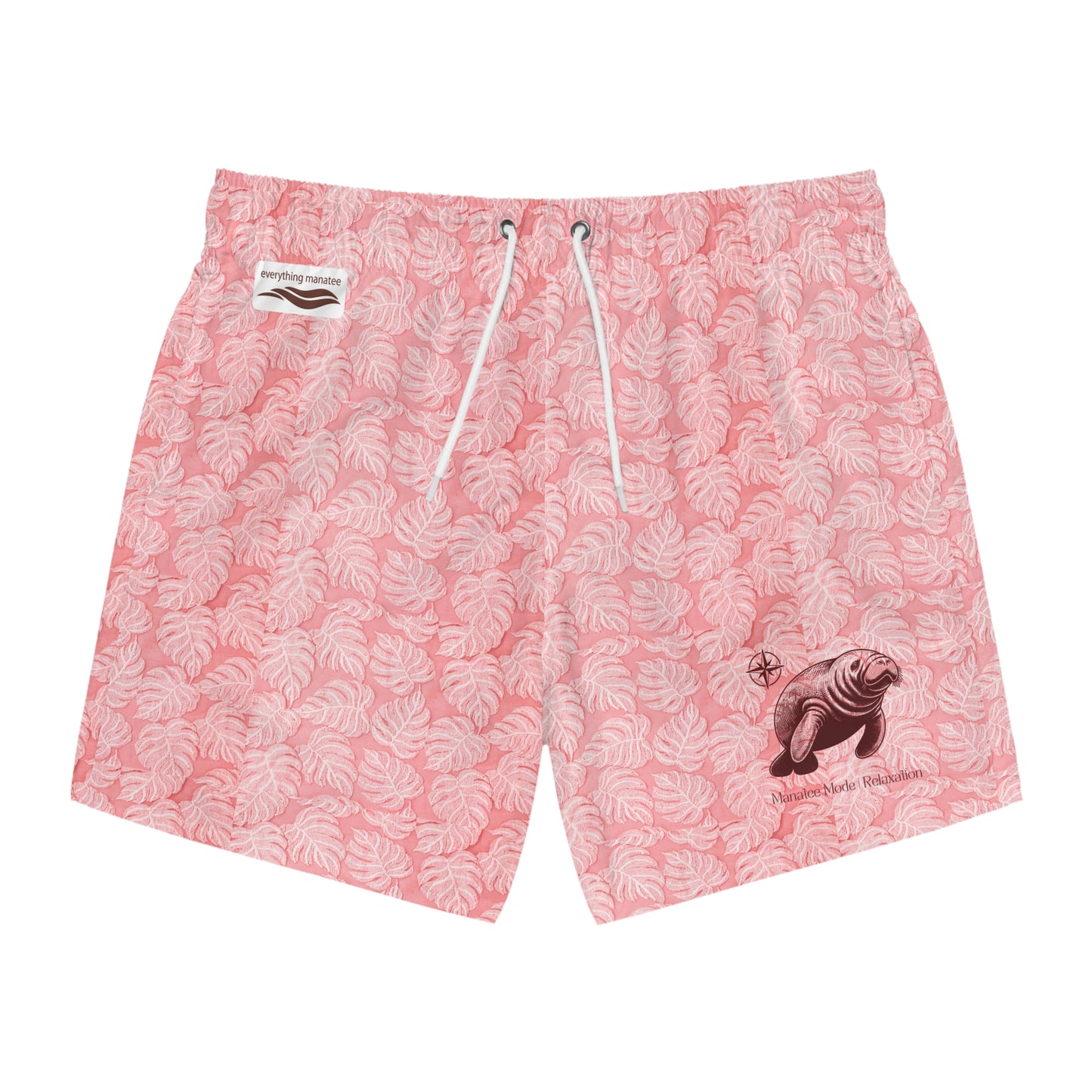Men's swim trunks with a pink tropical print and a manatee graphic on the left leg.