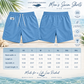 A size chart graphic for men's swim shorts by Everything Manatee, showing front and back views of light blue swim shorts above a sizing table from XS to 3XL with waist, length, and hip width measurements.