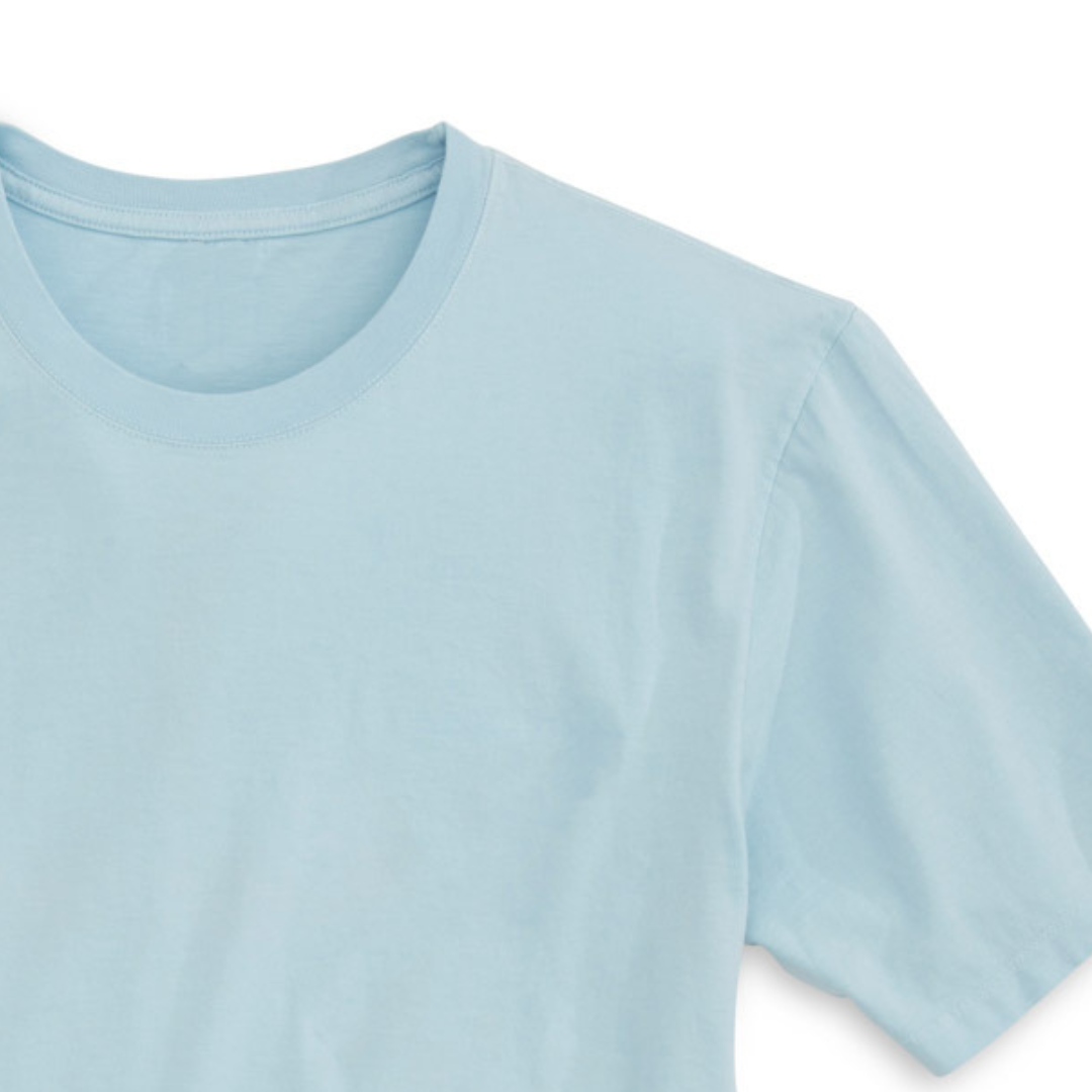 A side-view of the Spirit Animal Manatee T-Shirt in Blue Mist, displaying its knit tight work with fine yarn to control torque, garment washed to remove almost all shrinkage, and enzyme butterwashed to give the smoothest surface.