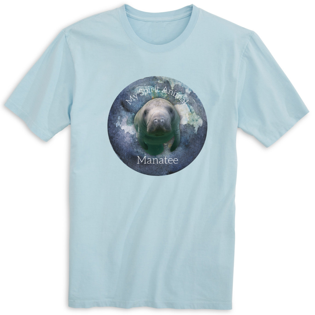 A front view of the Spirit Animal Manatee T-Shirt in Blue Mist, featuring a simple yet charming design with a cute graphic of a manatee and the words "Spirit Animal" printed above it.